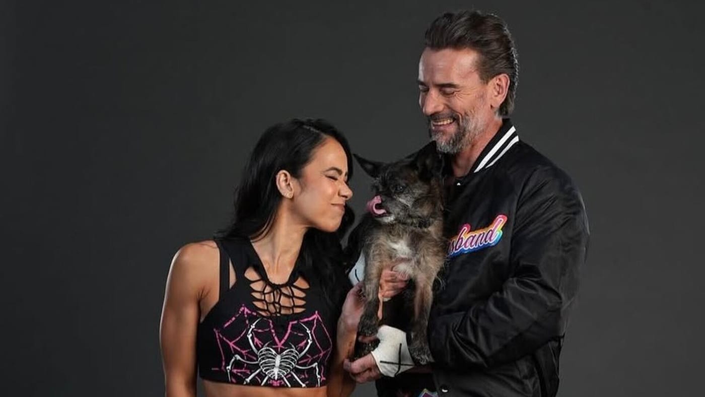 AJ Lee and CM Punk with Larry. Photo: WWE.com
