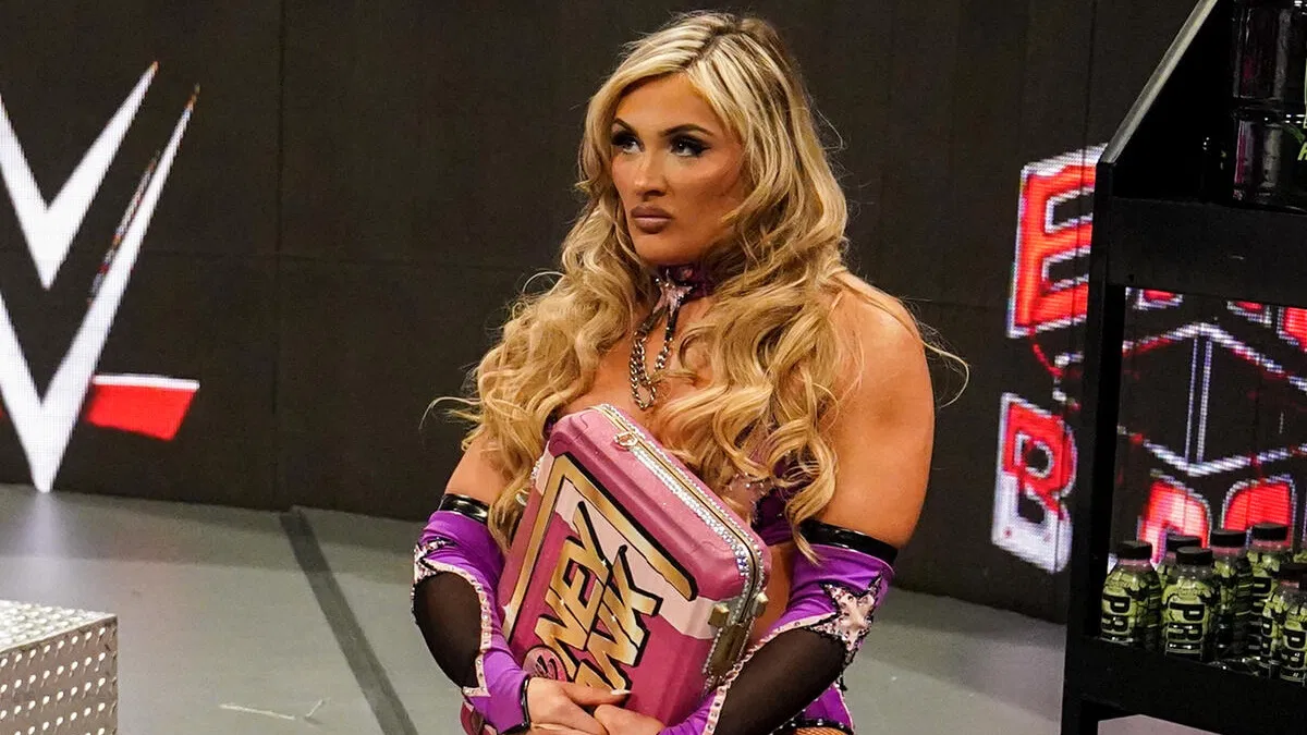Tiffany Stratton holds the Money in the Bank briefcase.
