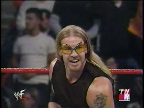 Edge and Christian give a 5-second pose before whooping Rehab Dogg and K-Kwik - Dec. 4, 2000