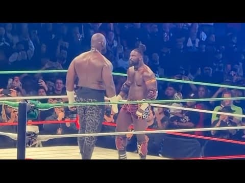 Oba Femi clothesline Omos over the top rope at Worlds Collide