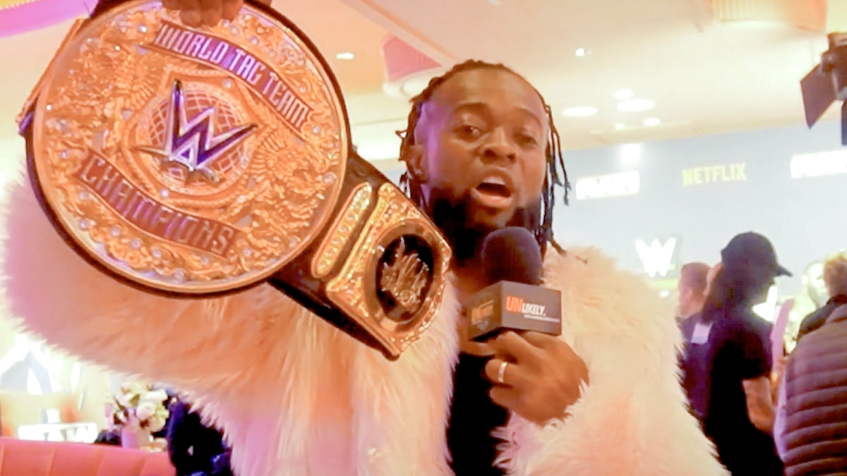 Kofi Kingston with WWE tag team championship belt